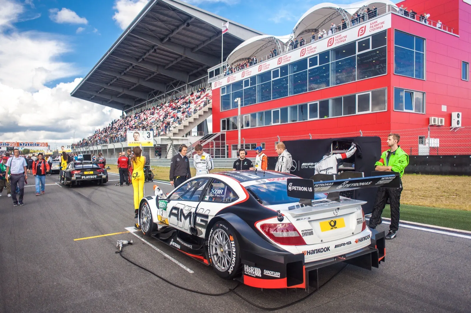 Racing driver grid preparation showing mental flow state priming routine before race start