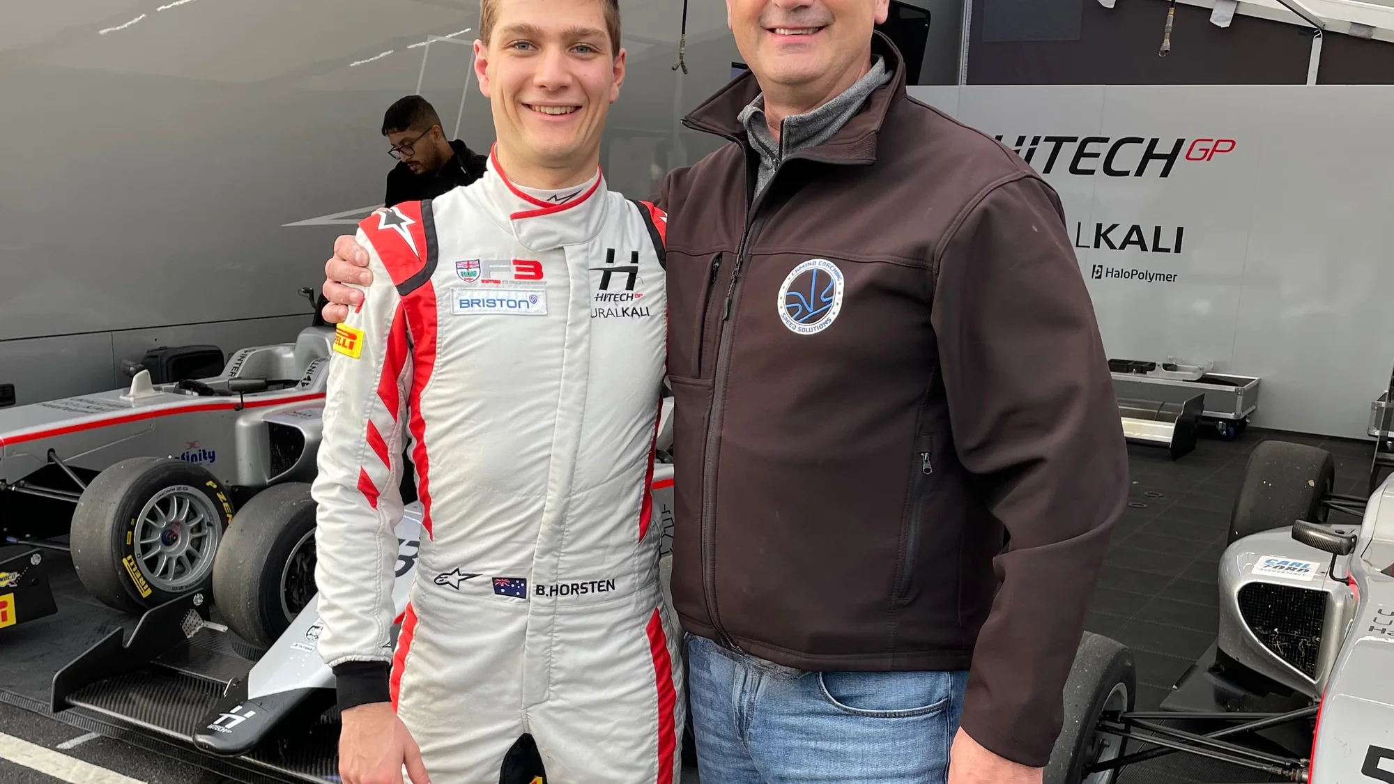 Craig Muirhead with a driver in the Hitech GP garage